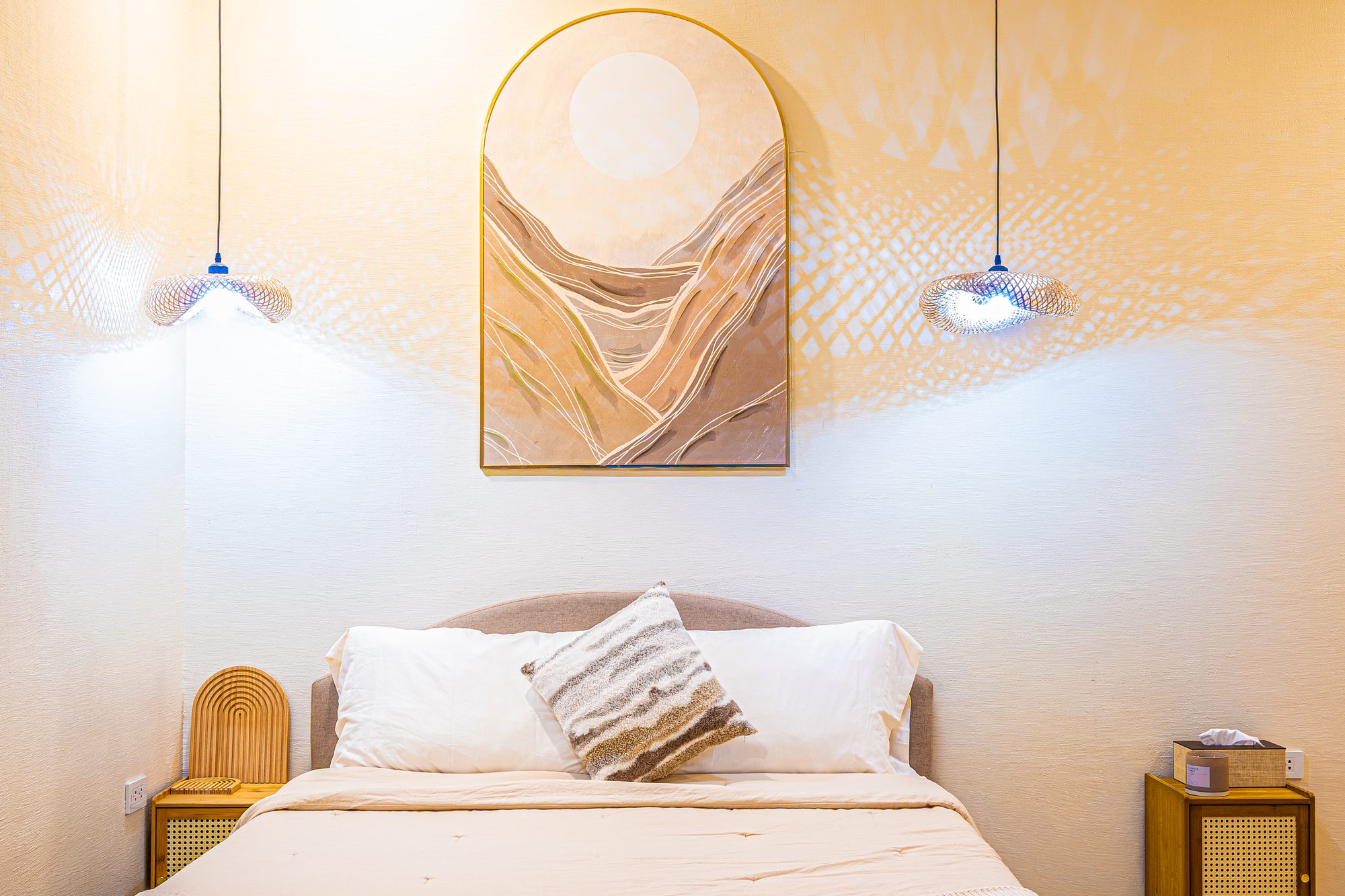 Bedroom with arched artwork